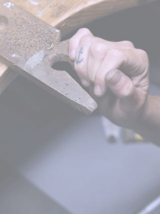 auri hand at the work bench